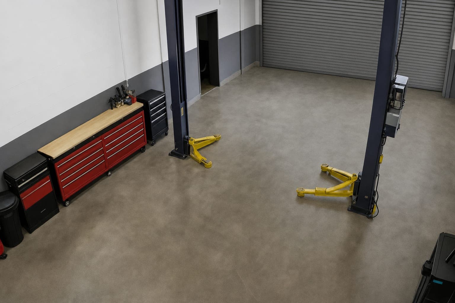 The empty bay between the lift posts with the roller door fully closed
